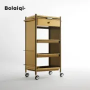 صورة عربة صالون فاخرة من الستانلس ستيل الذهبي بحاملات للأجهزة